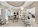 Open-concept living room with a view of the kitchen and dining area at 7019 Vilamoura Pl, Lakewood Ranch, FL 34202