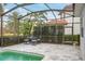 Relaxing screened-in pool area with seating and tranquil views at 7019 Vilamoura Pl, Lakewood Ranch, FL 34202