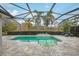 Inviting screened pool and patio area with lush landscaping at 7019 Vilamoura Pl, Lakewood Ranch, FL 34202