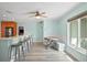 Kitchen breakfast nook with light wood cabinets and a built-in bench at 7342 Uranus Dr, Sarasota, FL 34243