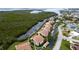 Aerial view of waterfront condo community, highlighting a specific unit and shared pool at 8644 54Th W Ave # 8644, Bradenton, FL 34210
