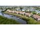 Aerial view of waterfront condos, emphasizing a specific unit's location and water access at 8644 54Th W Ave # 8644, Bradenton, FL 34210