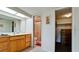Clean bathroom with double vanity, shower, and adjacent closet at 8644 54Th W Ave # 8644, Bradenton, FL 34210