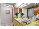 Updated bathroom with a shower/tub combo and yellow vanity at 8644 54Th W Ave # 8644, Bradenton, FL 34210