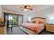 Spacious bedroom with king-size bed and private balcony access at 8644 54Th W Ave # 8644, Bradenton, FL 34210
