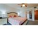 Relaxing bedroom with a queen bed, dresser, and access to a hallway at 8644 54Th W Ave # 8644, Bradenton, FL 34210