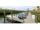 Boat docks alongside a tranquil waterway with lush vegetation at 8644 54Th W Ave # 8644, Bradenton, FL 34210