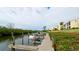 Wooden community boat dock with several boats moored at 8644 54Th W Ave # 8644, Bradenton, FL 34210