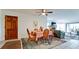 Condo dining area with table and chairs, adjacent to living room at 8644 54Th W Ave # 8644, Bradenton, FL 34210