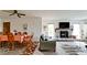 Bright living room features a fireplace, dining area, and comfy seating at 8644 54Th W Ave # 8644, Bradenton, FL 34210