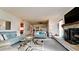 Living room features stone fireplace, comfortable seating, and large TV at 8644 54Th W Ave # 8644, Bradenton, FL 34210