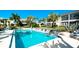 Community pool with plenty of lounge chairs for relaxing at 8644 54Th W Ave # 8644, Bradenton, FL 34210