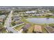 Community overview featuring houses and a central pond at 10605 58Th E St, Parrish, FL 34219