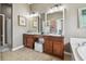 Double vanity bathroom with a large soaking tub and separate shower at 10605 58Th E St, Parrish, FL 34219