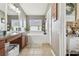 Relaxing bathroom with soaking tub, double sinks, and tile flooring at 10605 58Th E St, Parrish, FL 34219