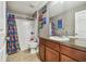 Bathroom with tub, shower, and superhero-themed decor at 10605 58Th E St, Parrish, FL 34219