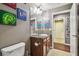 Clean bathroom with double vanity and wood cabinets at 10605 58Th E St, Parrish, FL 34219