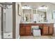 Spacious bathroom with double sinks, large mirrors, and a soaking tub at 10605 58Th E St, Parrish, FL 34219