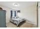 Cozy bedroom with a double bed and blue curtains at 10605 58Th E St, Parrish, FL 34219