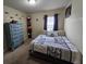 Guest bedroom with a queen-size bed, dresser, and plenty of closet space at 10605 58Th E St, Parrish, FL 34219