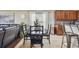 Dining area with black table and chairs near kitchen and living room at 10605 58Th E St, Parrish, FL 34219