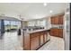 Open concept kitchen with island and stainless steel appliances at 10605 58Th E St, Parrish, FL 34219