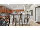 Modern kitchen with stainless steel appliances and an island with seating at 10605 58Th E St, Parrish, FL 34219
