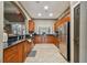 Community kitchen with wood cabinets and granite counters at 10605 58Th E St, Parrish, FL 34219