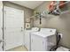 Laundry room with washer, dryer, and overhead shelving at 10605 58Th E St, Parrish, FL 34219