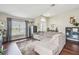 Relaxing living room with hardwood floors, sectional sofa, and natural light from large windows at 10605 58Th E St, Parrish, FL 34219