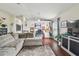 Bright living room featuring a sectional sofa and dark floors at 10605 58Th E St, Parrish, FL 34219