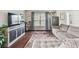 Comfortable living room boasts hardwood floors, sectional sofa, and large flat-screen TV at 10605 58Th E St, Parrish, FL 34219