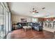 Open concept living room with a view of the kitchen and access to a patio at 10605 58Th E St, Parrish, FL 34219