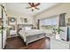 Large main bedroom with a gray sleigh bed and access to a bathroom at 10605 58Th E St, Parrish, FL 34219