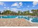 Inviting community pool with surrounding lounge chairs at 10605 58Th E St, Parrish, FL 34219