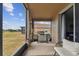 Enjoy this screened patio with grill and view of backyard at 10605 58Th E St, Parrish, FL 34219