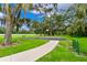 Outdoor basketball court nestled among lush trees at 11814 53Rd E Ct, Parrish, FL 34219