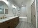 Bathroom with a double vanity, soaking tub, and modern design at 11814 53Rd E Ct, Parrish, FL 34219