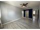 Second bedroom with an ensuite bathroom and light grey floors at 11814 53Rd E Ct, Parrish, FL 34219