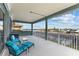 Relaxing balcony overlooking waterfront with seating for two at 1215 Acappella Ln, Apollo Beach, FL 33572