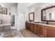 Elegant bathroom with double vanity and large shower at 1215 Acappella Ln, Apollo Beach, FL 33572