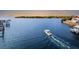 Aerial view of a boat cruising on calm waters at 1215 Acappella Ln, Apollo Beach, FL 33572