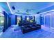 Home theater with elevated seating and bar area at 1215 Acappella Ln, Apollo Beach, FL 33572
