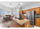 Spacious kitchen with island, stainless steel appliances, and granite countertops at 1215 Acappella Ln, Apollo Beach, FL 33572