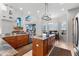 Spacious kitchen featuring an island, breakfast bar, and granite countertops at 1215 Acappella Ln, Apollo Beach, FL 33572