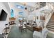 Spacious living area with high ceilings, fireplace, and water views at 1215 Acappella Ln, Apollo Beach, FL 33572