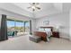 Large main bedroom with sliding doors leading to a balcony at 1215 Acappella Ln, Apollo Beach, FL 33572