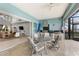 Outdoor kitchen with stainless steel appliances and dining area at 1215 Acappella Ln, Apollo Beach, FL 33572