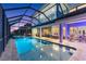 Inviting heated pool and spa with a covered patio area at 1215 Acappella Ln, Apollo Beach, FL 33572