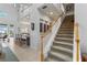 Elegant staircase with white railings, leading to upper level at 1215 Acappella Ln, Apollo Beach, FL 33572